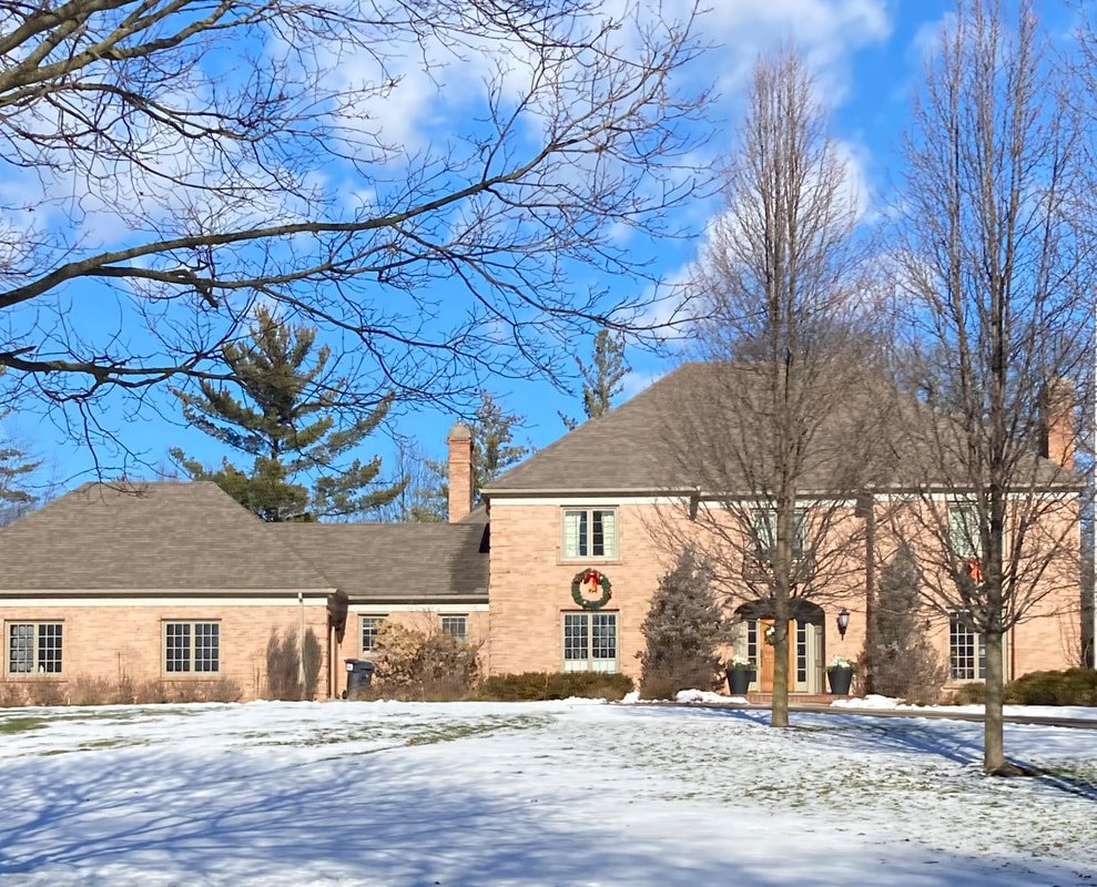 Quality Roof Repair home in Grand Rapids with new replacement windows